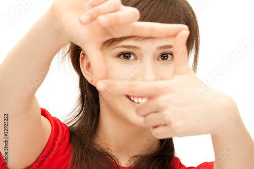 teenage girl creating a frame with fingers