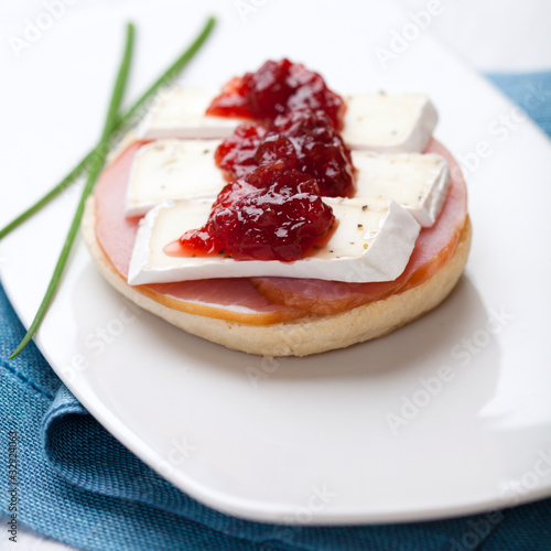 Canape with camembert and cranberry jam