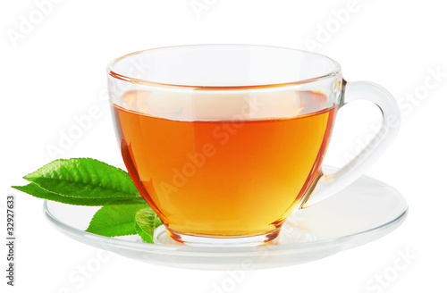 Cup with tea and green leaf
