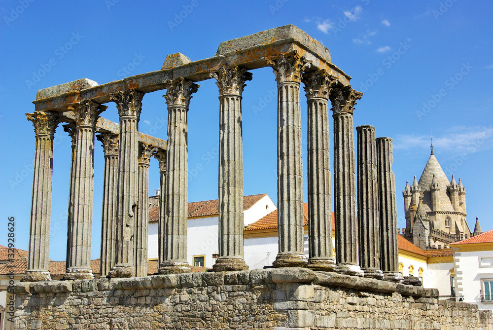 Roman temple and cathedral tower of Evora, Portugal.