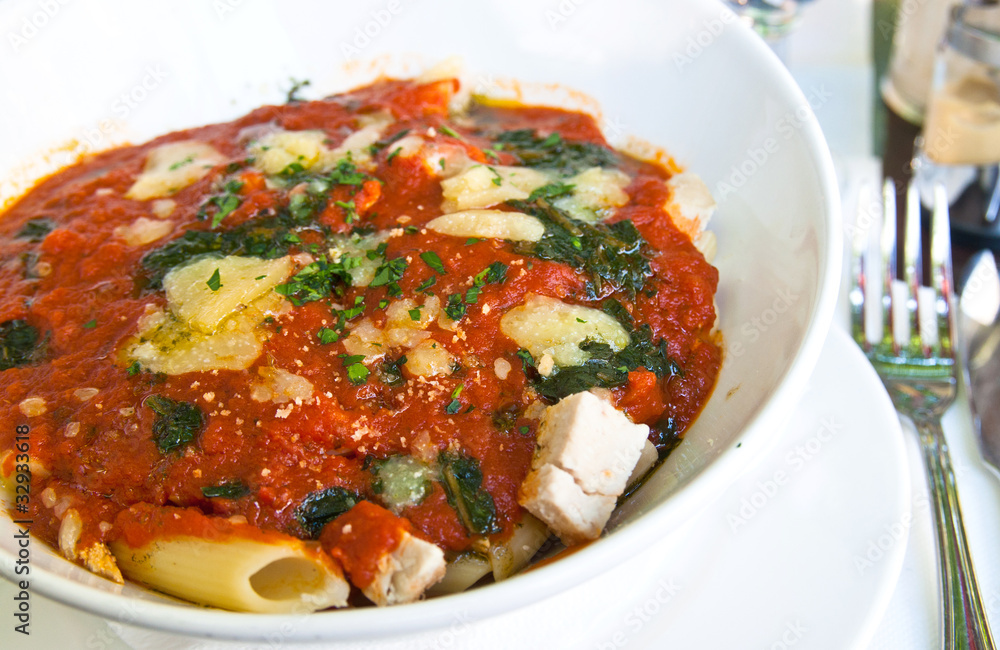 close-up of plate of pasta and chicken close-up of plate of pasta and chicken