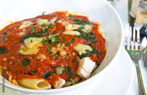 close-up of plate of pasta and chicken