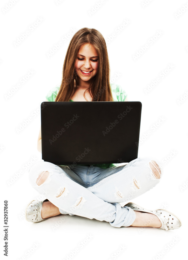 Attractive teenage girl using notebook computer Attractive teenage girl using notebook computer