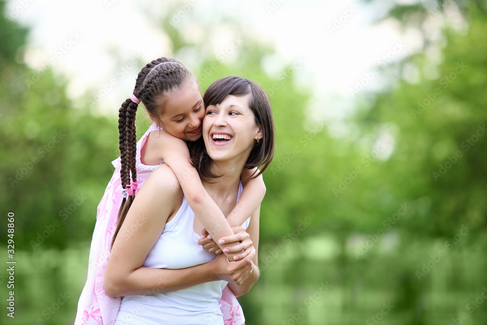 Fototapeta premium Young mother and her young daughter