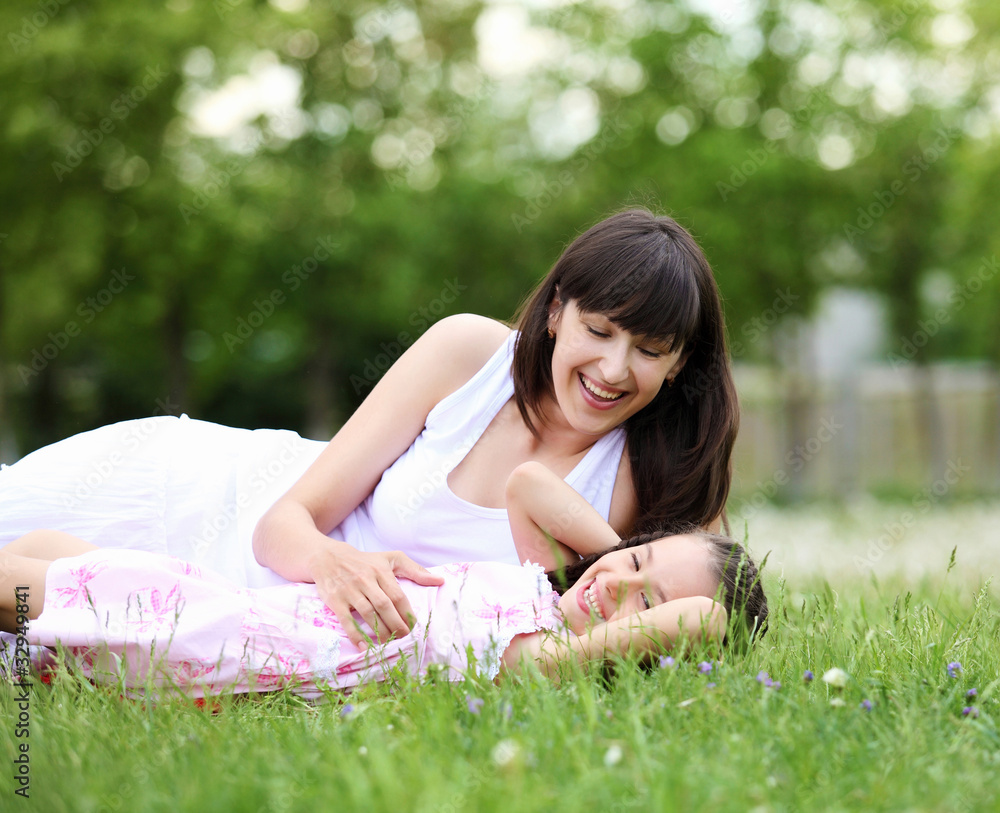 Young mother and her young daughter Young mother and her young daughter