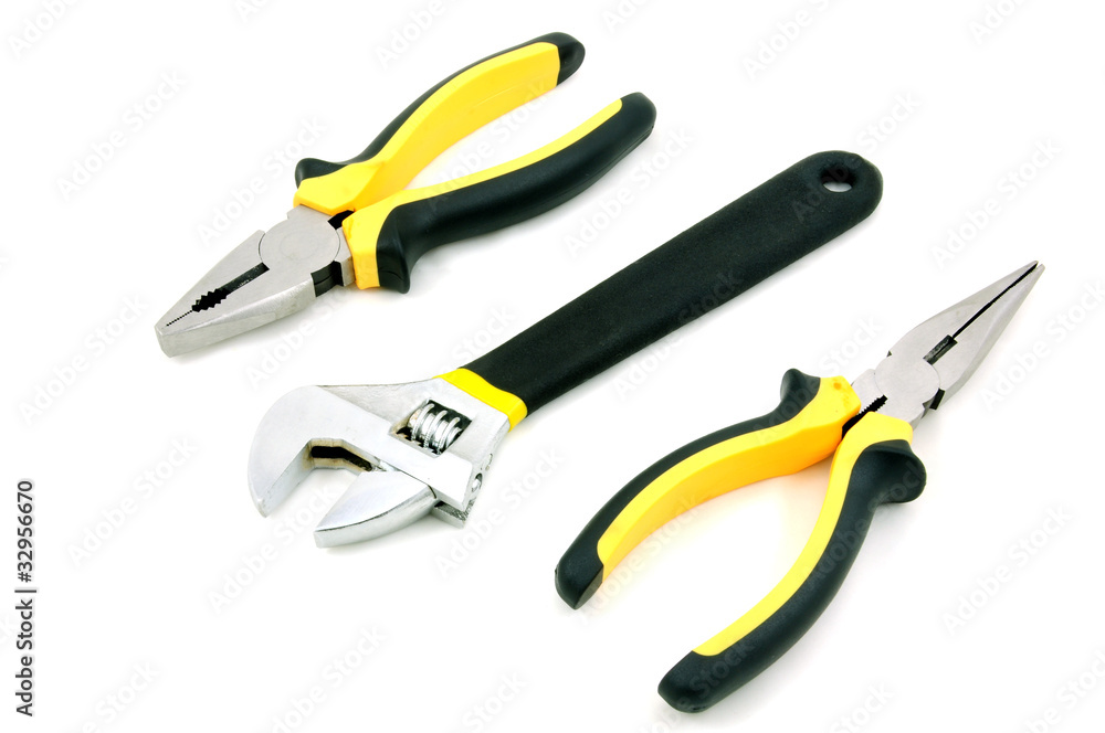Adjustable wrench, long & Flat nose pliers isolated on white background Adjustable wrench, long & Flat nose pliers isolated on white background
