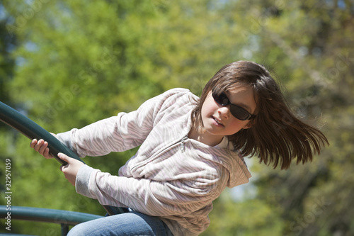 Girl leans out on ride.