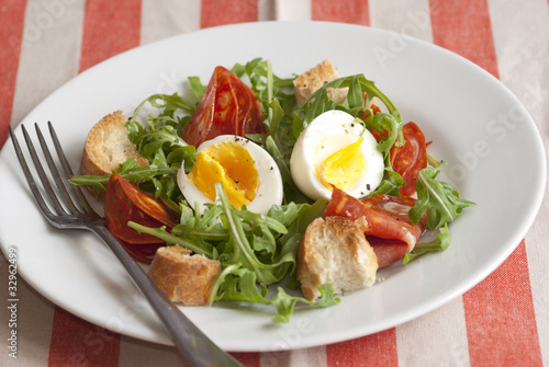 Leaf salad with chorizo and boiled eggs