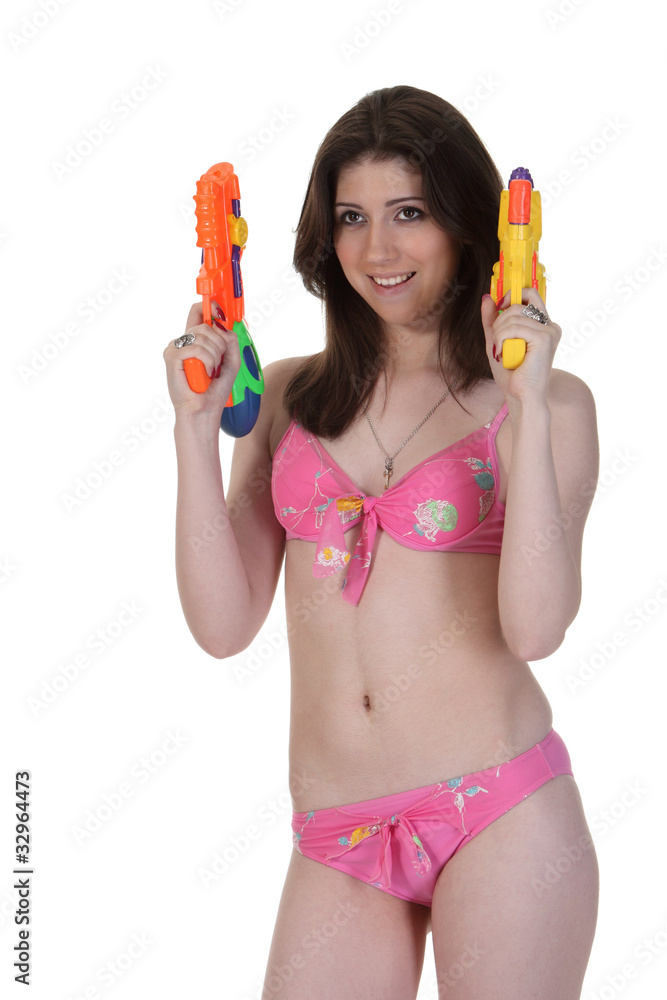 Bikini girl with two water gun Stock Photo | Adobe Stock