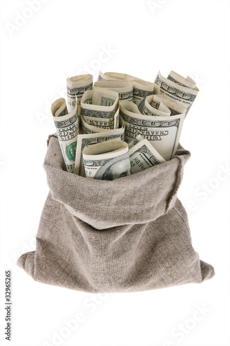 Dollar money bills into a bag