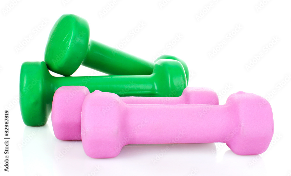 Pink and Green Dumbbells on the white background Pink and Green Dumbbells on the white background