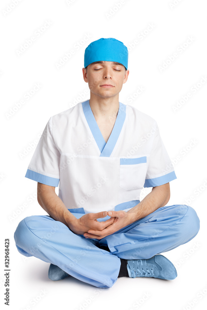medical doctor meditating in lotus pose