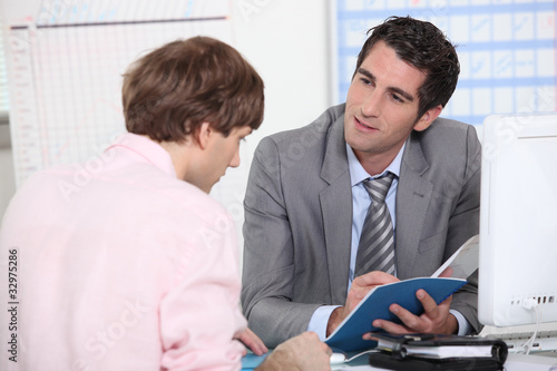 Tutor advising his student