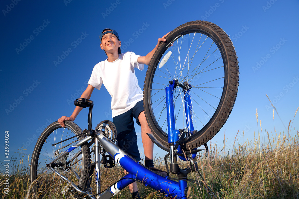 The boy with a bicycle The boy with a bicycle