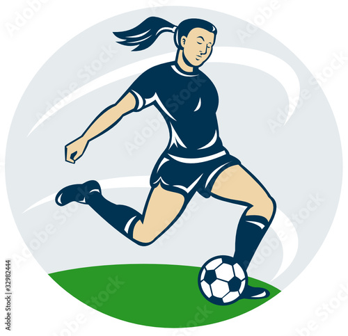 woman soccer player kicking ball