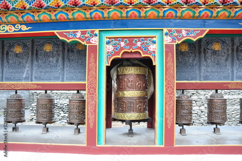 Buddhist prayer wheels, Upper Pissang, Nepal photo