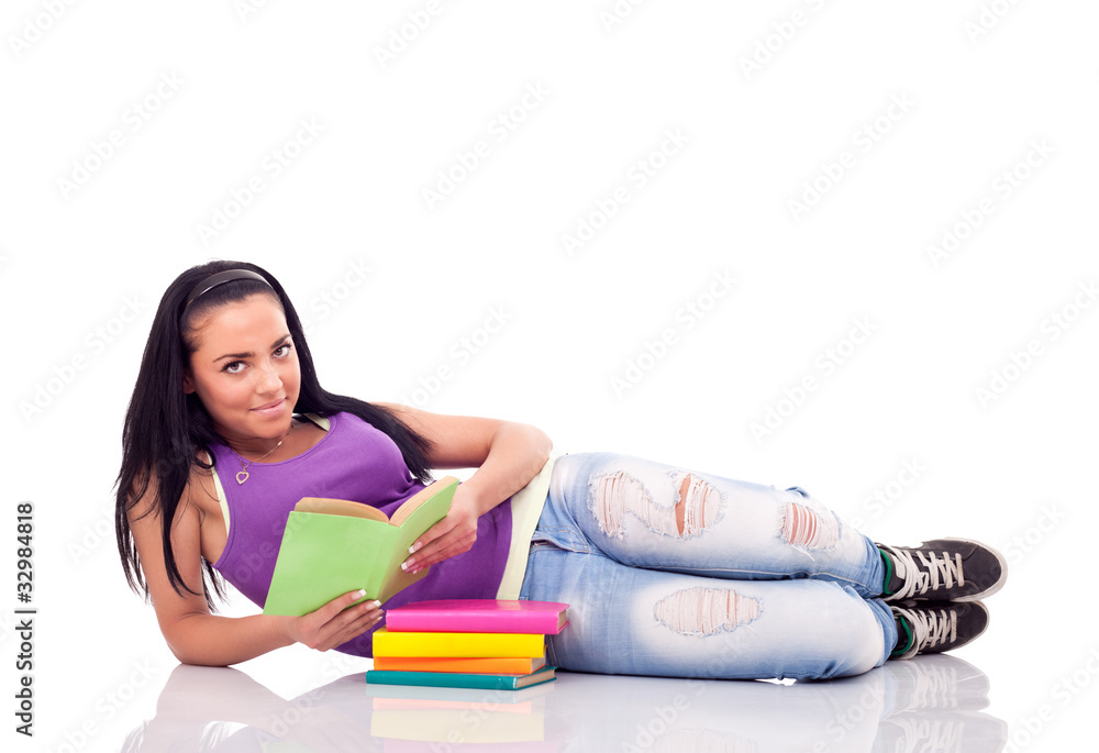 teenager with book lying on floor teenager with book lying on floor
