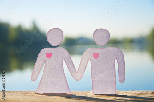 Paper doll couple holding hands