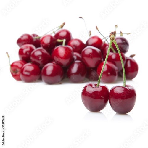 Fresh cherries isolated on white.