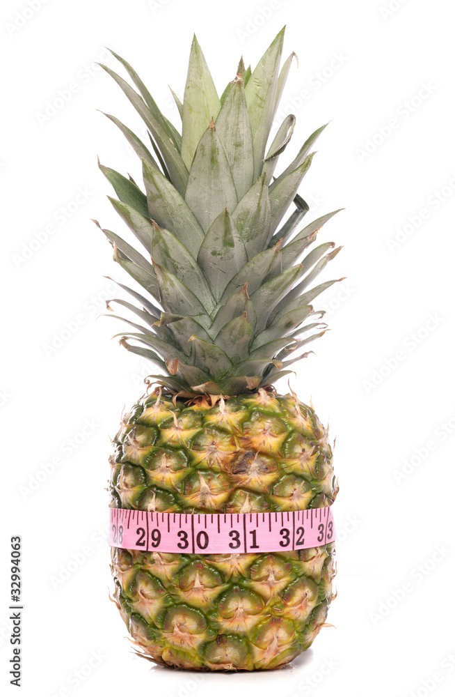 Fototapeta premium Pineapple with tape measure