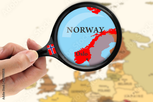 Magnifying glass over a map of Norway