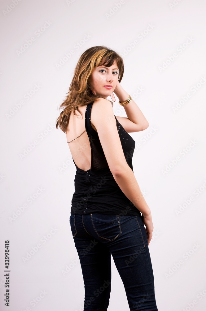 Portrait of pretty woman turning and giving you an smile Portrait of pretty woman turning and giving you an smile