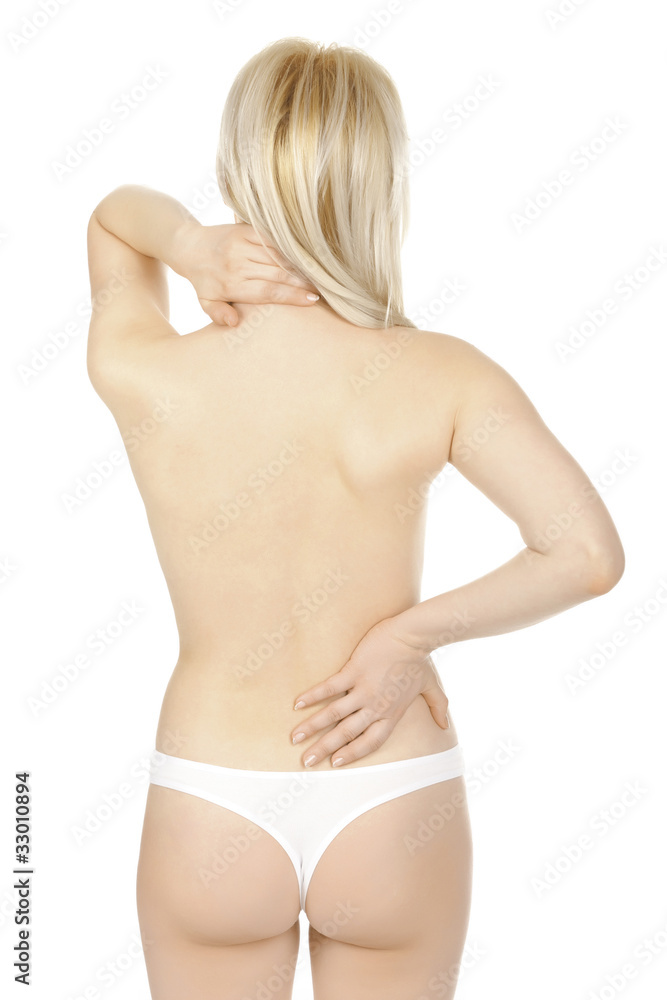 Woman massaging pain back isolated over a white background. Woman massaging pain back isolated over a white background.