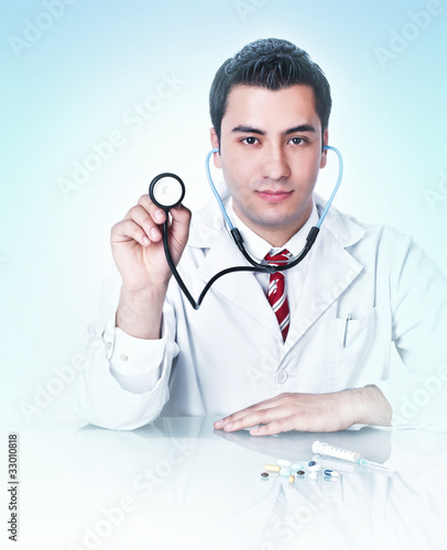 Doctor holding stethoscope,isolated on white background photo