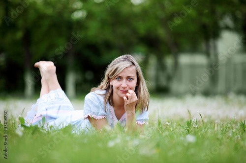 Young blond woman in the park © Sergey Nivens