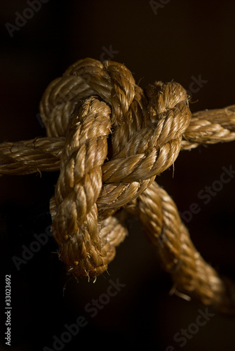 Closeup of tight note on old rope