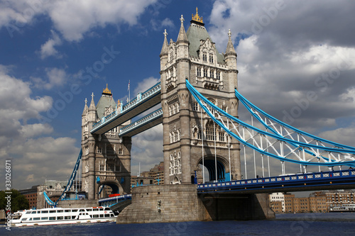 Tower Bridge with city cruise in London, UK