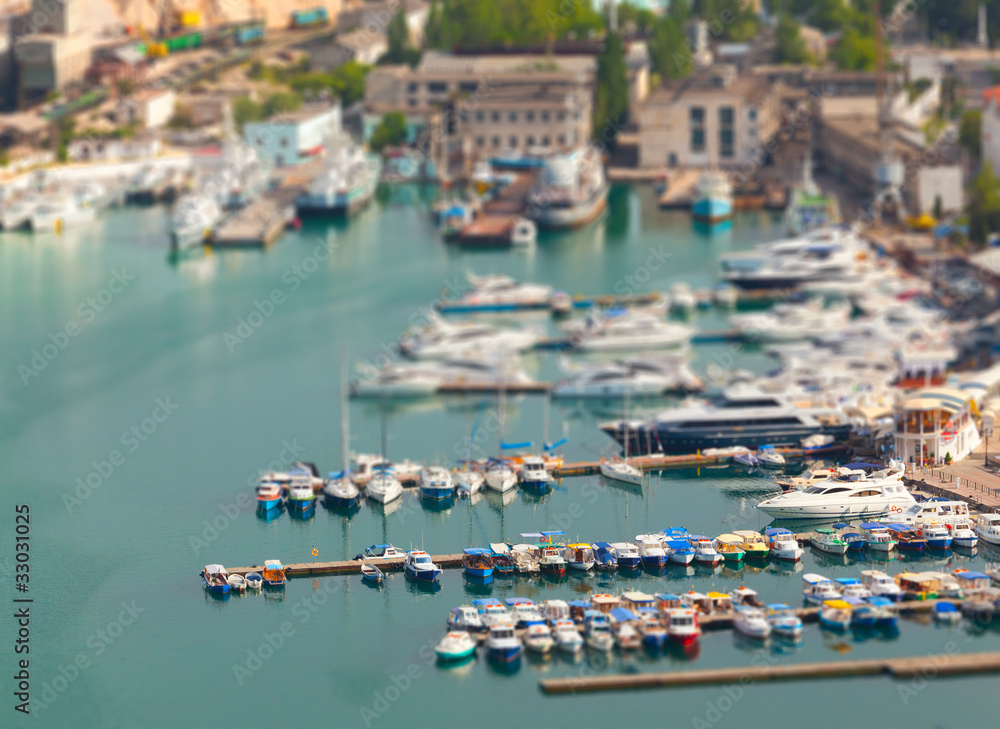 Bay with sailboats in the summer. Tilt Shift effect