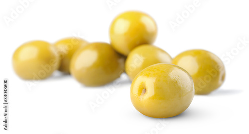 Green olives isolated on white, selective focus