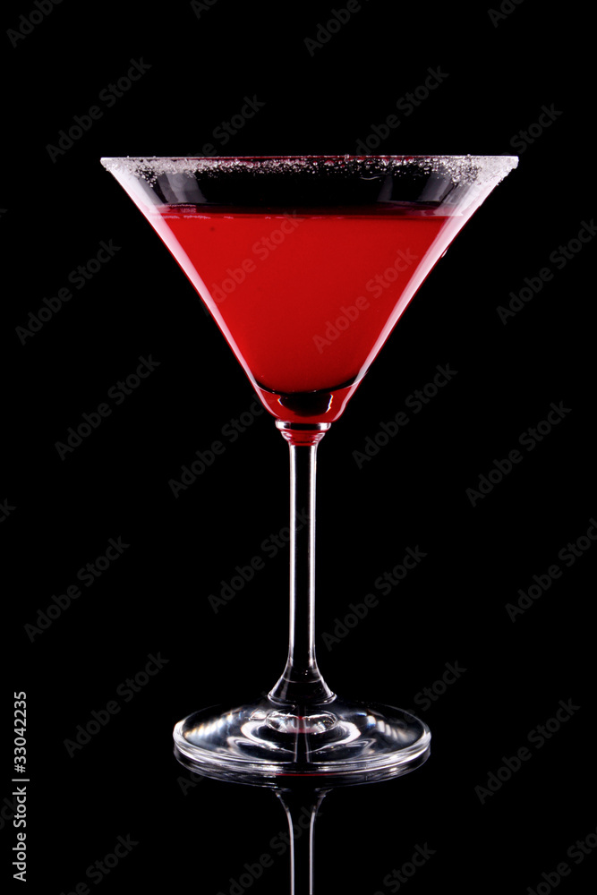 Martini glass with red coctail on black background Martini glass with red coctail on black background