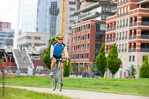 Mature cyclist in city park