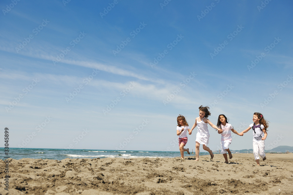 happy child group playing on beach happy child group playing on beach