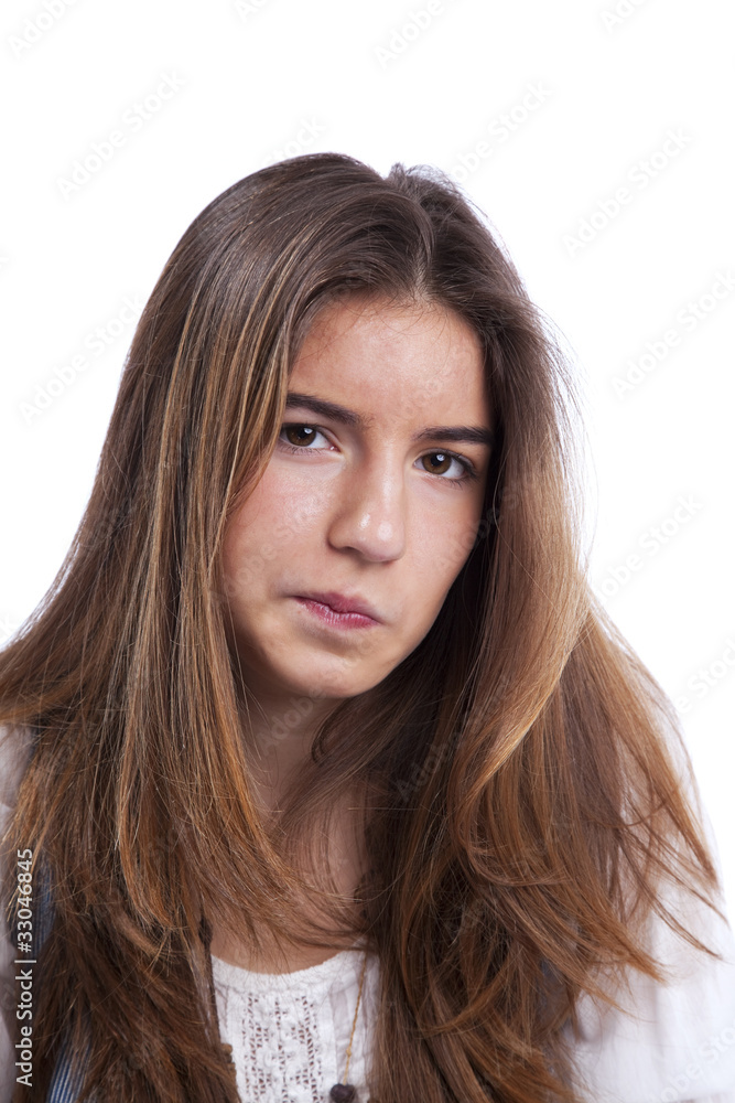 Suspicious young teenager woman face (isolated on white) Suspicious young teenager woman face (isolated on white)