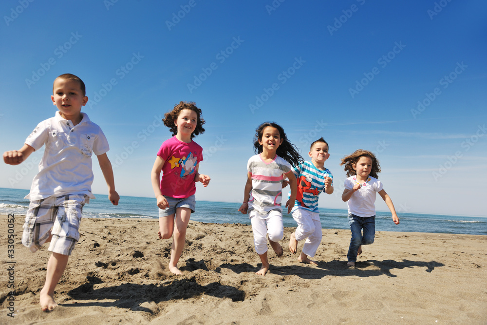 happy child group playing on beach happy child group playing on beach