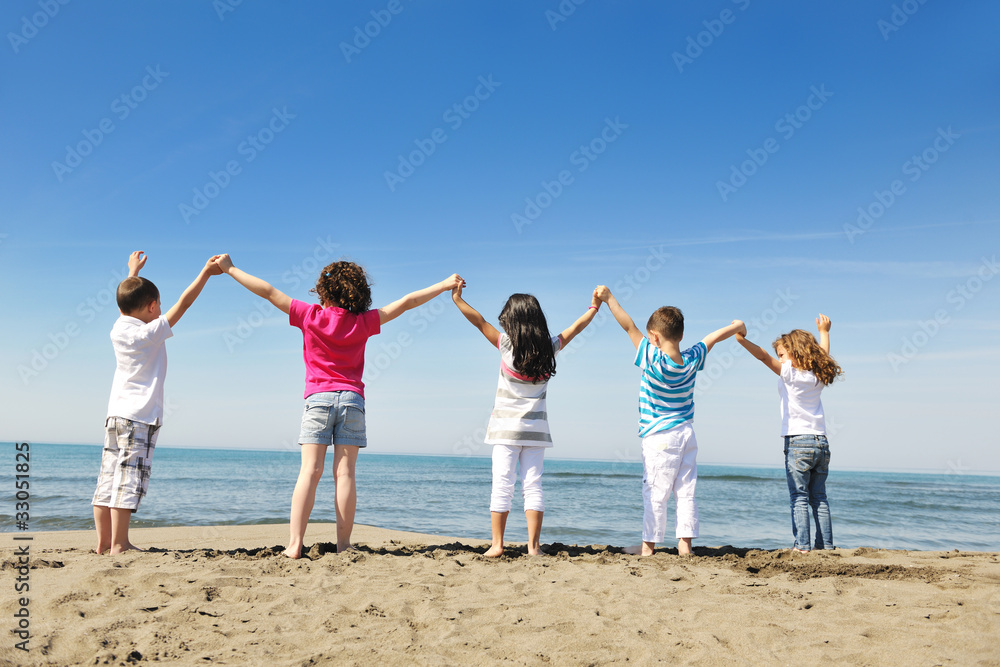happy child group playing on beach happy child group playing on beach