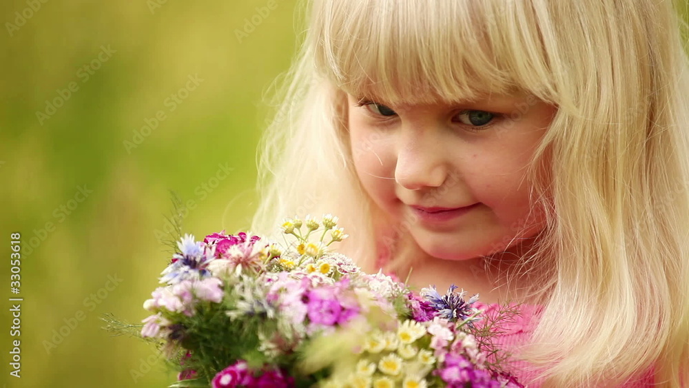 Close up portrait of a little blonde with flowers. Close up portrait of a little blonde with flowers.