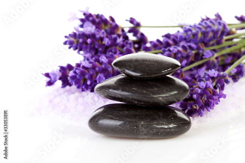 stacked black stepping stones and lavender flowers