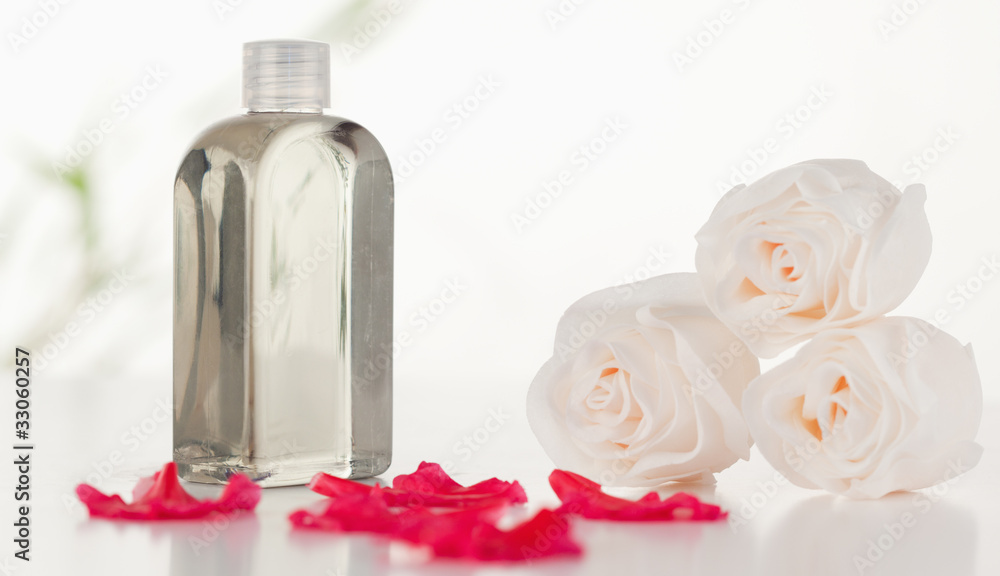 Glass flask with petals and roses Glass flask with petals and roses