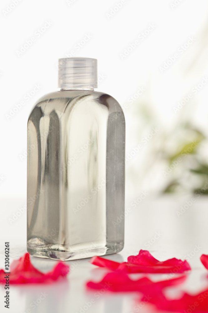 Glass flask an pink petals Glass flask an pink petals