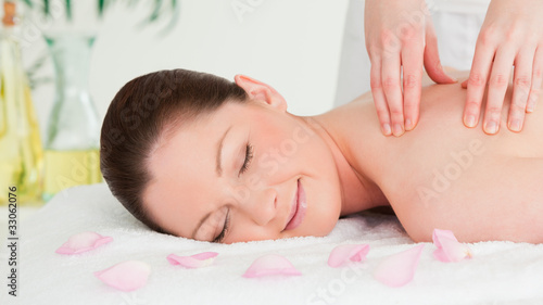 Cute woman receiving a massage in a spa