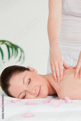 Portrait of a young woman closing her eyes during a massage