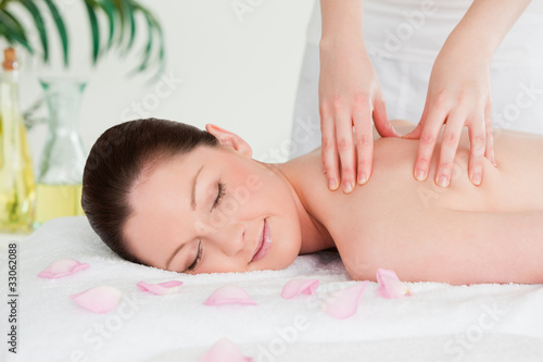 Cute woman closing her eyes during a massage