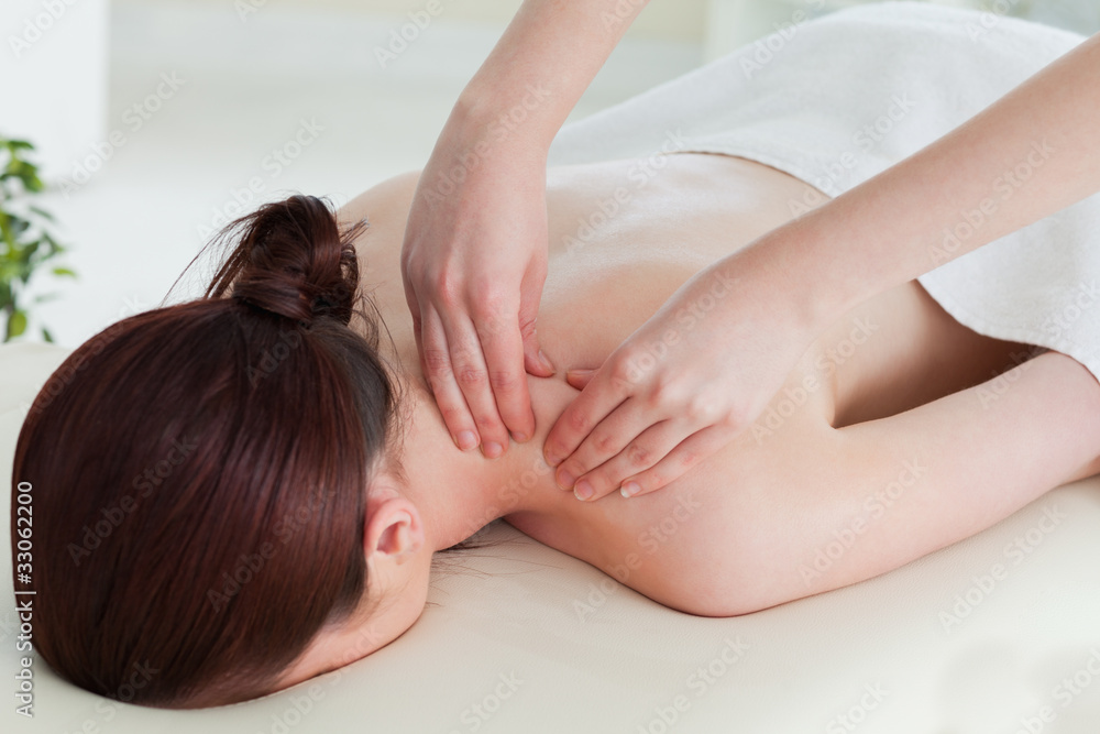 Red-haired woman having a rolling massage Red-haired woman having a rolling massage