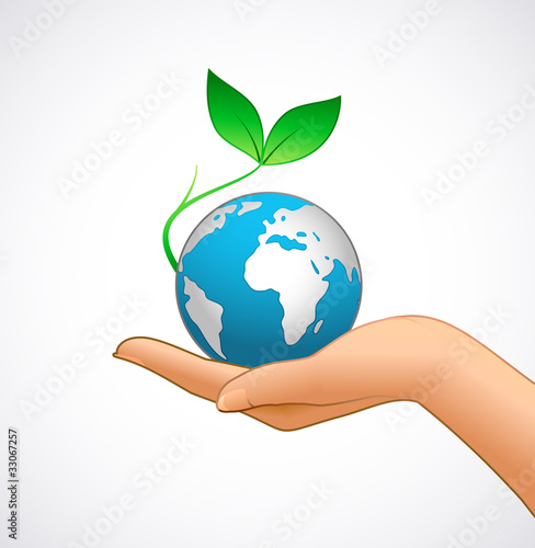 Woman’s hand is holding small earth