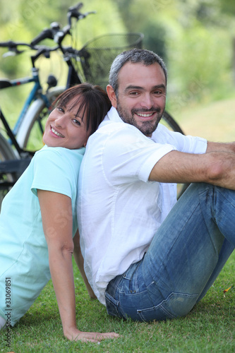 Couple having a bike ride in the country © auremar