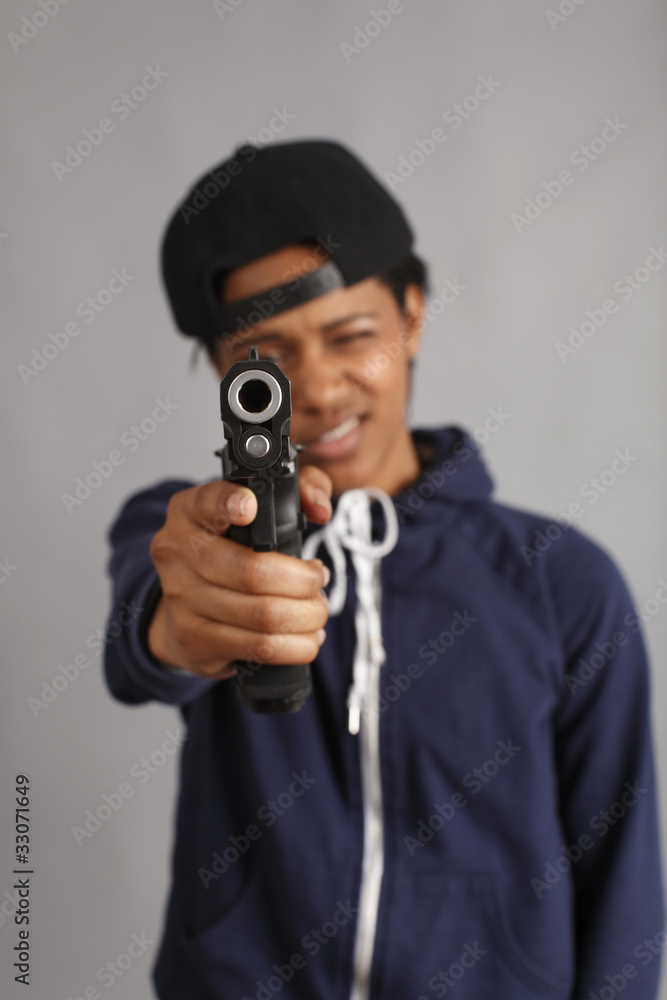Young woman dressed like a gangster with pistol. Young woman dressed like a gangster with pistol.